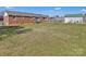 Spacious backyard features a brick exterior, green lawn and detached garage at 109 Connor Ct, Kings Mountain, NC 28086