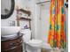 Bathroom featuring a shower with bright and colorful curtains, a decorative vanity, and ladder shelving at 109 Connor Ct, Kings Mountain, NC 28086