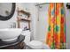 Bathroom featuring a shower with bright and colorful curtains, a decorative vanity, and ladder shelving at 109 Connor Ct, Kings Mountain, NC 28086