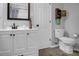 Cozy bathroom features a white vanity with dark accents, toilet, and decor at 109 Connor Ct, Kings Mountain, NC 28086