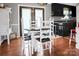 Cozy dining area features hardwood floors and a table with white chairs, perfect for Gathering meals at 109 Connor Ct, Kings Mountain, NC 28086