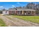 Charming brick home with a yellow front door and inviting front porch at 109 Connor Ct, Kings Mountain, NC 28086