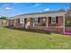 Charming brick home with a yellow front door and inviting front porch at 109 Connor Ct, Kings Mountain, NC 28086