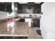 This kitchen features dark cabinets, stainless steel appliances and neutral countertops at 109 Connor Ct, Kings Mountain, NC 28086