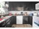 This kitchen features dark cabinets, stainless steel appliances and neutral countertops at 109 Connor Ct, Kings Mountain, NC 28086
