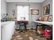 Well-lit home office with sewing machine and crafting space ideal for creative projects at 109 Connor Ct, Kings Mountain, NC 28086