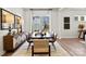 Modern dining room features a large window, stylish buffet, a modern table with seating for six, and an area rug at 1110 Sugar Creek Rd, Indian Land, SC 29707