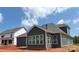 Exterior view of a home with gray siding and various window sizes at 1110 Sugar Creek Rd, Indian Land, SC 29707