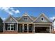 Charming home featuring stone accents, a decorative gable, and an attached two-car garage at 1110 Sugar Creek Rd, Indian Land, SC 29707