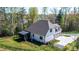 View of the home's backyard featuring a fenced yard, screened-in porch, and professional landscaping at 112 Whitman Ct # 275, Taylorsville, NC 28681