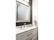 Modern bathroom featuring a gray accent wall, a stylish mirror and vanity with a white countertop at 112 Whitman Ct # 275, Taylorsville, NC 28681