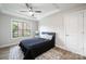 Inviting bedroom with natural light, tray ceiling, a comfortable bed and wood-look flooring at 112 Whitman Ct # 275, Taylorsville, NC 28681