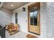 Charming front porch featuring a wooden door, rocking chairs, and a welcoming entryway at 112 Whitman Ct # 275, Taylorsville, NC 28681