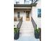 Inviting front entrance with brick stairs, decorative planters, and a covered porch area at 112 Whitman Ct # 275, Taylorsville, NC 28681