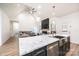 Open-concept kitchen with island, stainless appliances and adjacent living room with fireplace at 112 Whitman Ct # 275, Taylorsville, NC 28681