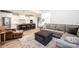Open concept living room and kitchen area with modern decor and comfortable seating at 112 Whitman Ct # 275, Taylorsville, NC 28681