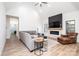 Bright living room with comfortable seating, fireplace, and modern design elements at 112 Whitman Ct # 275, Taylorsville, NC 28681
