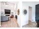 Bright living room includes a fireplace, a TV, wood floors, and stylish furniture for comfortable lounging and entertaining at 112 Whitman Ct # 275, Taylorsville, NC 28681