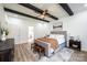 Bedroom features wood-beamed ceiling, wood floors, neutral walls, a queen bed, and an en-suite bath at 112 Whitman Ct # 275, Taylorsville, NC 28681