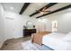 Spacious main bedroom with a beamed ceiling and light wood floors, has an ensuite bath for added privacy at 112 Whitman Ct # 275, Taylorsville, NC 28681