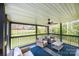 Relaxing screened porch with comfortable seating and view of the wooded backyard at 112 Whitman Ct # 275, Taylorsville, NC 28681