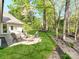 Backyard featuring an outdoor firepit and seating area, perfect for entertaining at 117 Wrenwood Ln, Charlotte, NC 28211