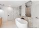 Sleek bathroom showcasing a modern soaking tub and stylish tile work at 117 Wrenwood Ln, Charlotte, NC 28211