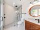 Stylish bathroom featuring a glass shower and unique wood-finished vanity at 117 Wrenwood Ln, Charlotte, NC 28211