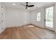 Bright bedroom with hardwood floors, natural light, and a private outdoor access at 117 Wrenwood Ln, Charlotte, NC 28211