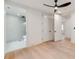 Bright bedroom with hardwood floors and an en-suite bathroom with modern shower at 117 Wrenwood Ln, Charlotte, NC 28211