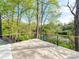 Scenic deck overlooking lush greenery, perfect for outdoor relaxation and entertaining at 117 Wrenwood Ln, Charlotte, NC 28211