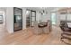 Bright dining room featuring hardwood floors, modern chandelier, and access to pantry at 117 Wrenwood Ln, Charlotte, NC 28211