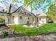 Backyard view with patio, fire pit, and lush landscaping at 117 Wrenwood Ln, Charlotte, NC 28211