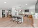 Expansive open kitchen with island seating and chef's stove at 117 Wrenwood Ln, Charlotte, NC 28211