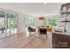 Comfortable seating area filled with natural light, overlooking a pool deck at 117 Wrenwood Ln, Charlotte, NC 28211