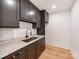 Mudroom features stylish dark cabinets, marble counters, and modern fixtures at 117 Wrenwood Ln, Charlotte, NC 28211