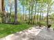 Spacious patio with seating offers a great view of the lush backyard at 117 Wrenwood Ln, Charlotte, NC 28211