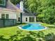 Backyard swimming pool, perfect for relaxation and entertainment surrounded by lush greenery at 117 Wrenwood Ln, Charlotte, NC 28211