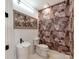 Unique powder room with designer wallpaper and pedestal sink at 117 Wrenwood Ln, Charlotte, NC 28211
