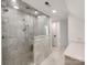 A glass-walled shower with a built-in bench in the updated bathroom at 117 Wrenwood Ln, Charlotte, NC 28211
