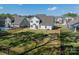 Aerial view of the home, showcasing the expansive backyard, black fence, and surrounding neighborhood at 12526 Dunloe Wood Dr, Huntersville, NC 28078