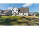A well-maintained backyard features a black fence and lush green grass, creating a serene outdoor space at 12526 Dunloe Wood Dr, Huntersville, NC 28078