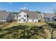 Aerial view of a backyard featuring a fenced in lawn and patio area at 12526 Dunloe Wood Dr, Huntersville, NC 28078