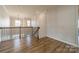 Upstairs hallway area featuring decorative wall trim and hardwood floors at 12526 Dunloe Wood Dr, Huntersville, NC 28078