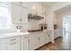 Well-appointed kitchen with white cabinets, subway tile backsplash, and stainless steel appliances at 12526 Dunloe Wood Dr, Huntersville, NC 28078