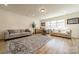Inviting living room featuring ample seating, natural light, and stylish décor at 12526 Dunloe Wood Dr, Huntersville, NC 28078
