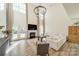 Grand living room with soaring ceilings, fireplace, and large windows allowing plenty of natural light at 12526 Dunloe Wood Dr, Huntersville, NC 28078