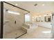 Luxurious bathroom with glass-enclosed shower, soaking tub, and double vanity sinks at 12526 Dunloe Wood Dr, Huntersville, NC 28078