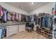 Spacious walk-in closet with ample storage, custom shelving, and well-organized hanging space at 12526 Dunloe Wood Dr, Huntersville, NC 28078