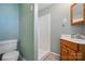 Bathroom featuring a sink, shower, toilet and tile flooring at 140 Oak Ave, Mount Holly, NC 28120
